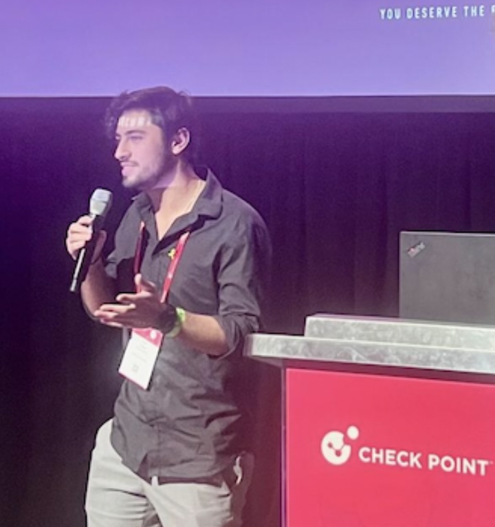 Dan Lasker speaking at a cybersecurity conference in Las Vegas